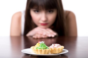 Dieting Woman Craving For Cake