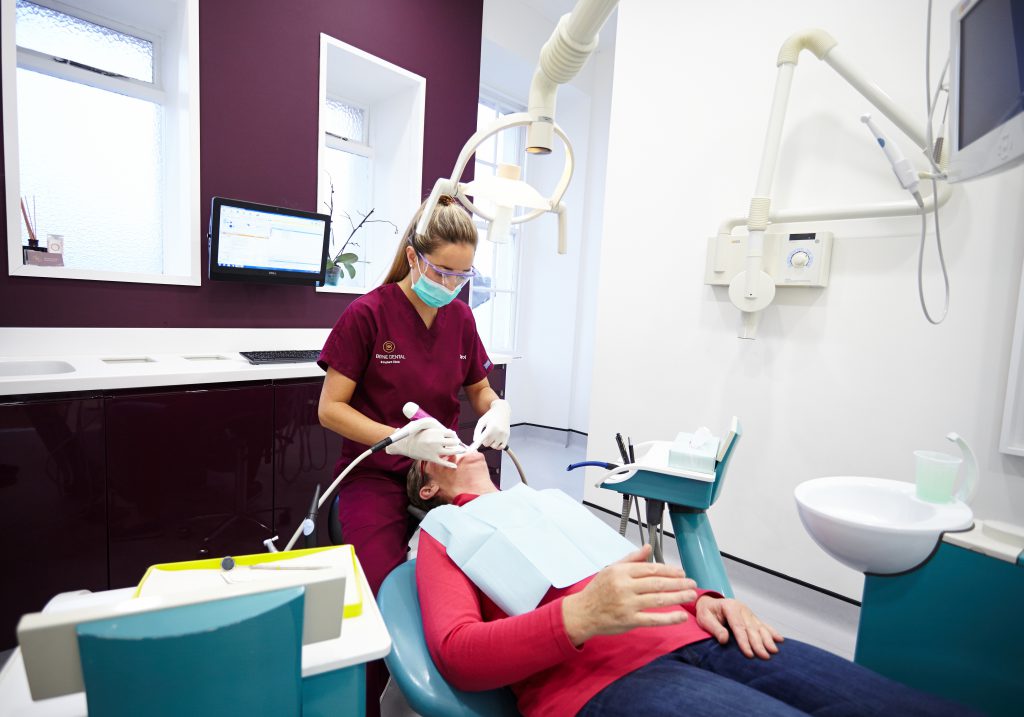 Hygienist Carol McGovern with patient